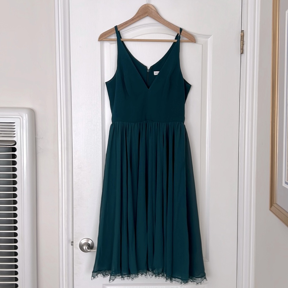 Mid length teal dress from “Dress The Population” in size medium